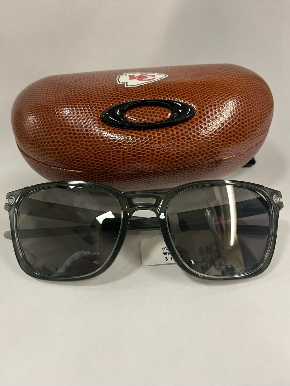Oakley Gray Transparent Frame Sunglasses with Dark Lenses